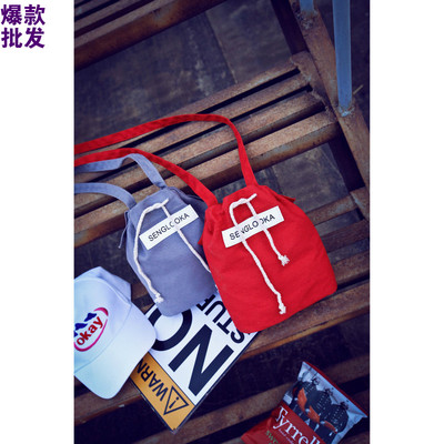 韩版夏季新款时尚水桶帆布小包包单肩斜跨包女士潮包抽绳字母女包